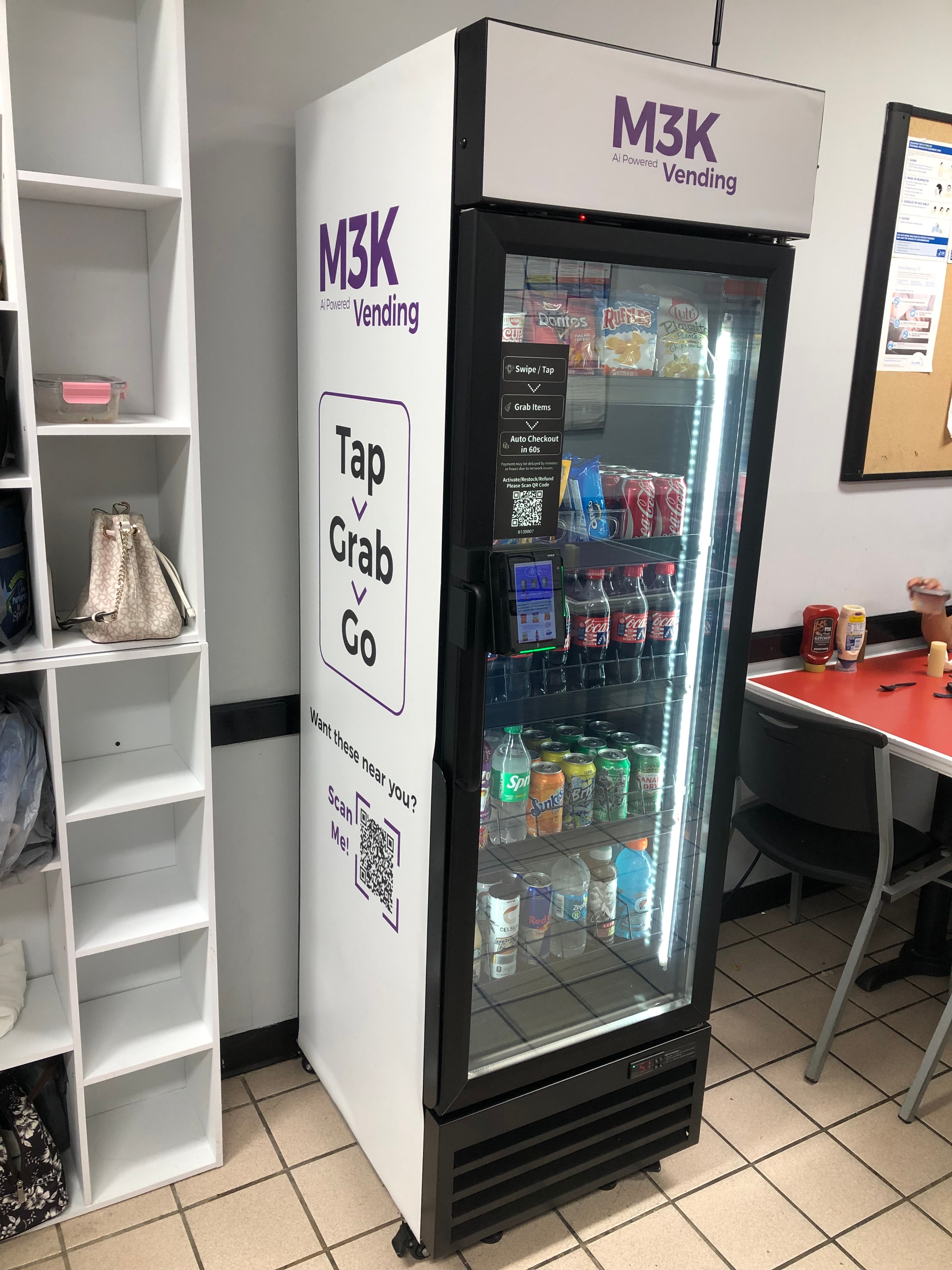 M3K vending machine shown at an angle highlighting its sleek glass-front design