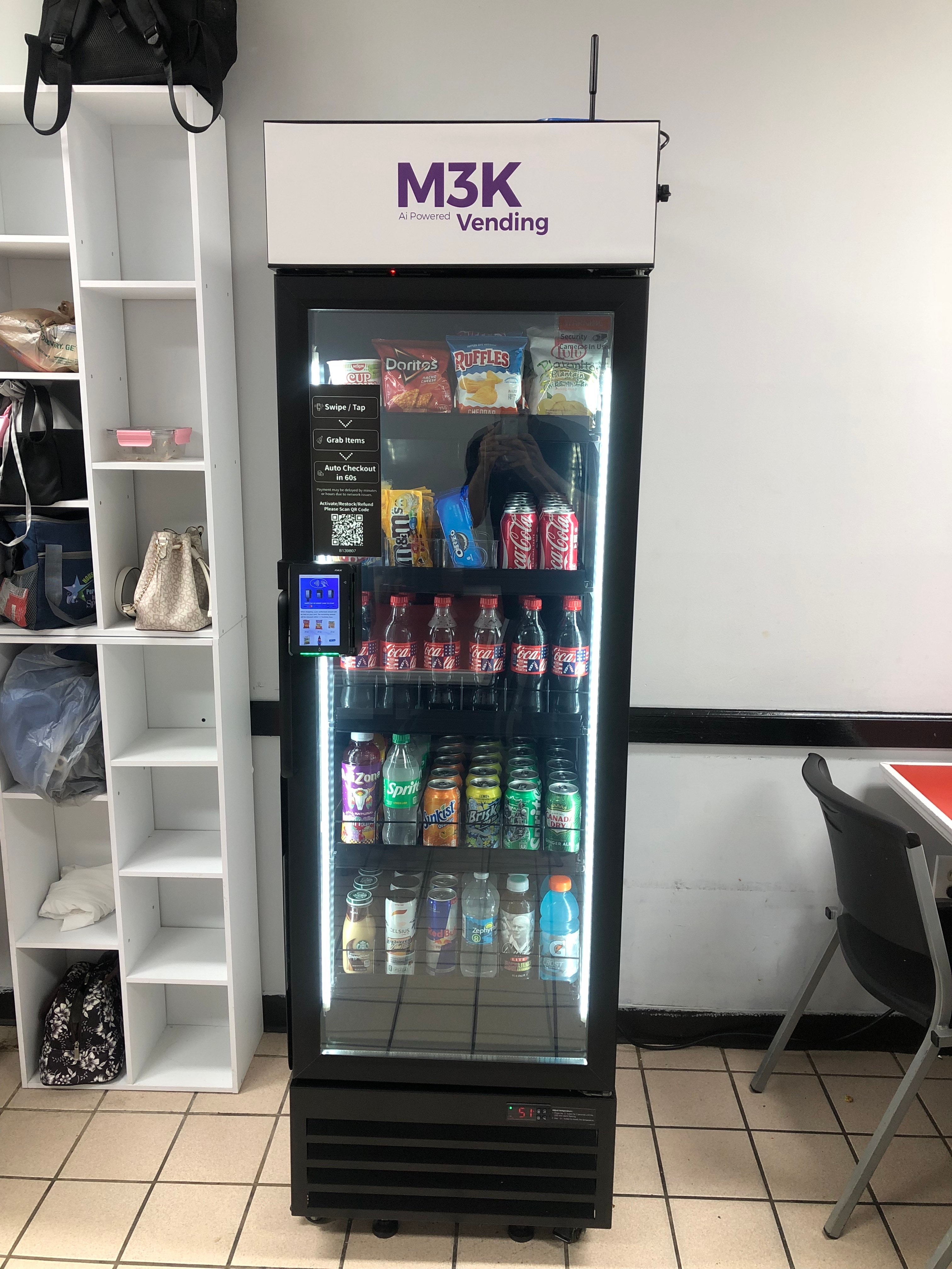 Front view of an M3K vending machine stocked with snacks and drinks